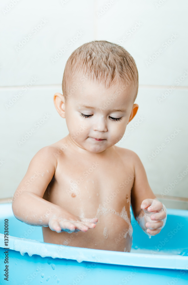 Happy baby boy taking a bath Happy baby boy taking a bath