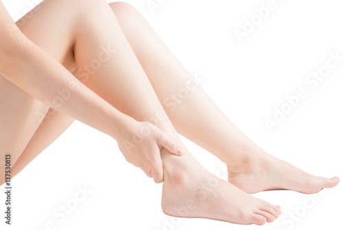 Acute pain in a woman  ankle isolated on white background. Clipping path on white background.
