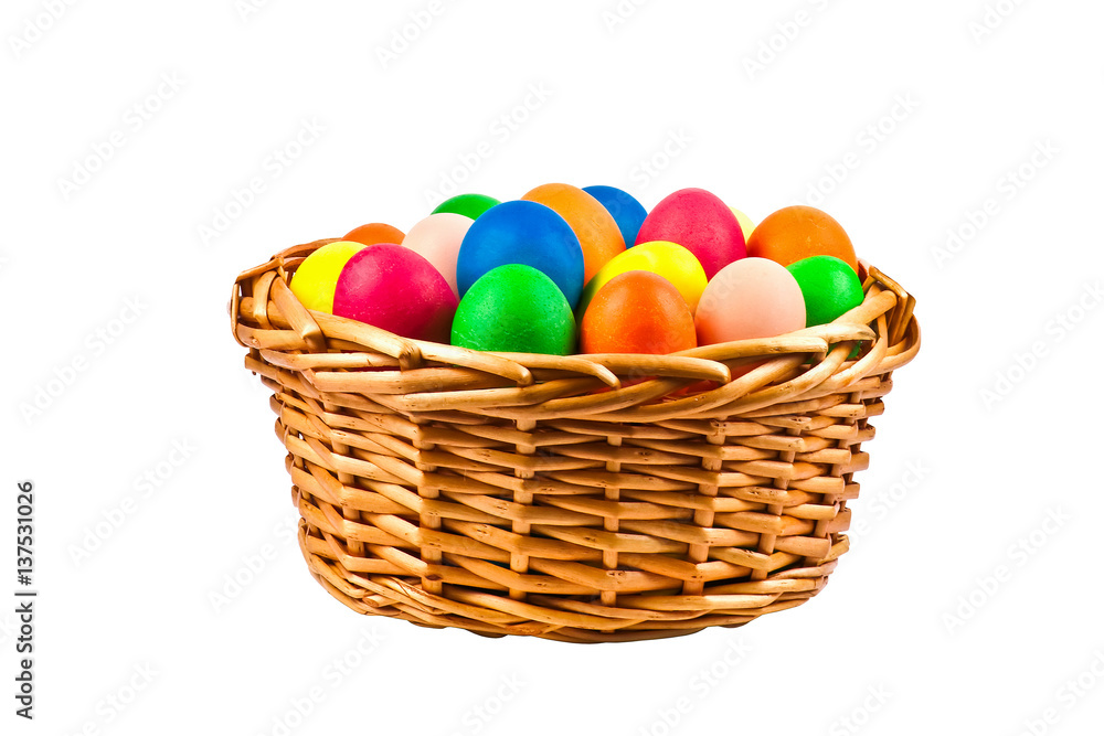 basket with Easter eggs isolated on white background