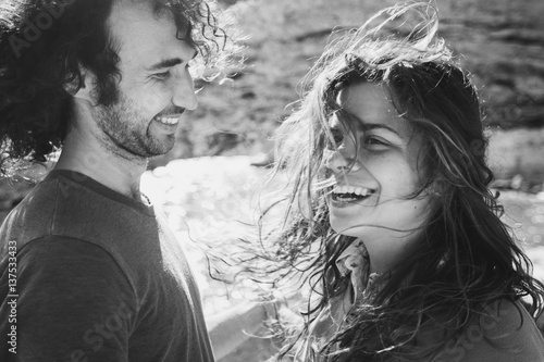 Lovely couple having fun in sunlight. Long curly hair, happiness and pleasure