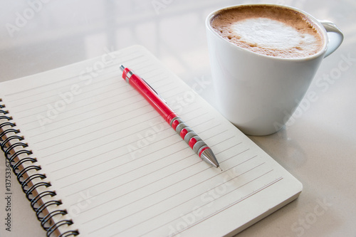 pencil and blank notebook with coffee on white table, closeup pencil and blank notebook