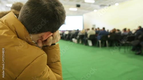 Presentation for audience - listener feels bored during high technology agricultural seminar photo