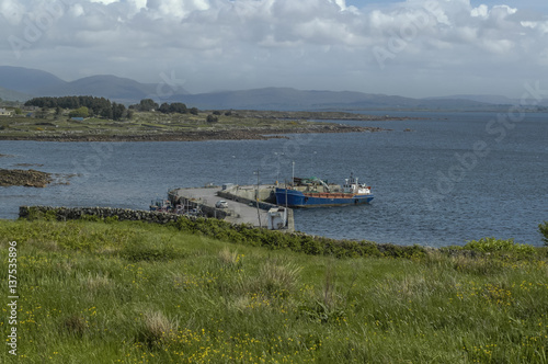 The coast line of the sea. Ship at pier.