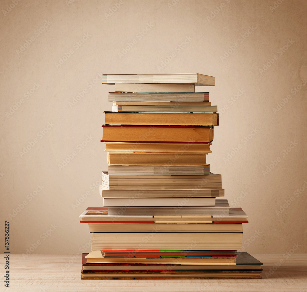 Fototapeta premium A stack of books with vintage background