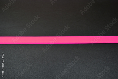 Stripe in a middle. Pink line at bottom. Pink color of belt. Belt from leather