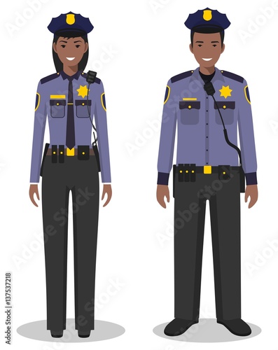 Couple of african american policeman and policewoman standing together on white background in flat style. Police USA concept. Flat design people characters. Vector illustration.