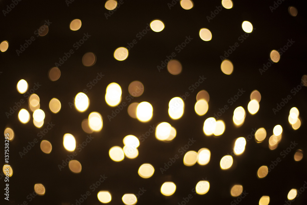 Golden bokeh on black background Golden bokeh on black background