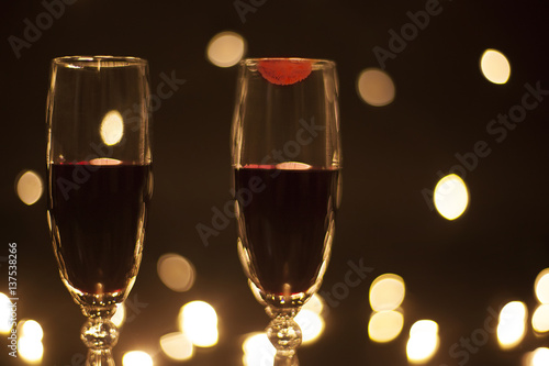 Closeup goblets with red wine imprint lipstick on the glass
