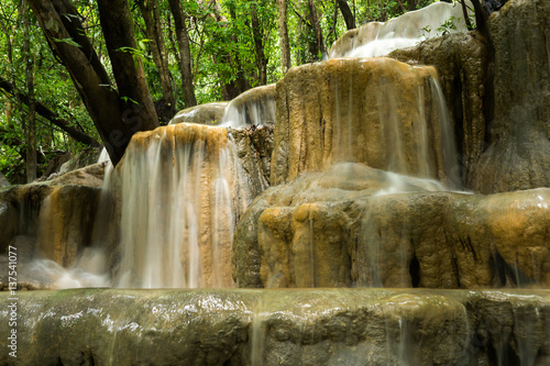 Limestone waterfall in the rainforest, Thailand.