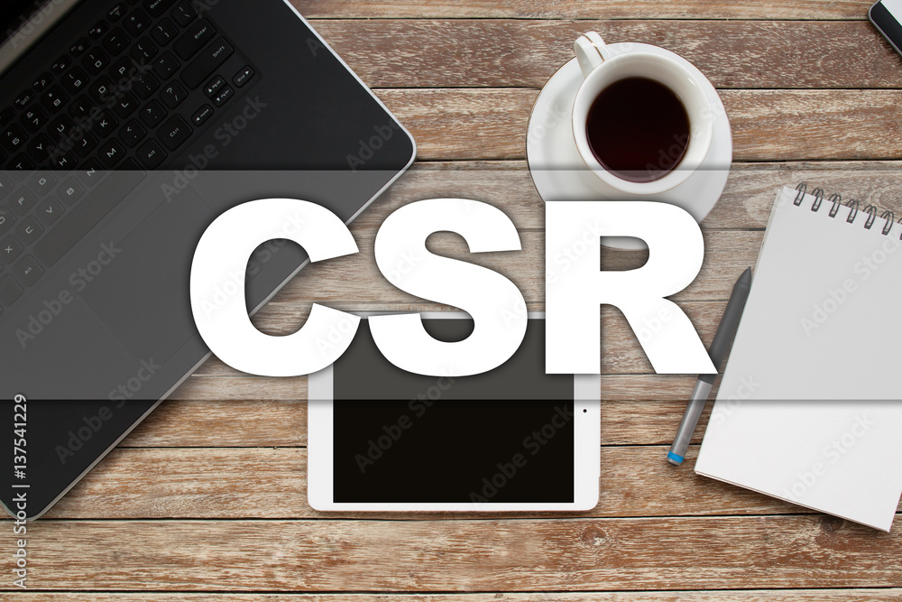 Tablet on desktop with csr text. Tablet on desktop with csr text.