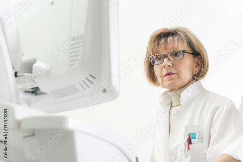 Female doctor and echocardiography machine
