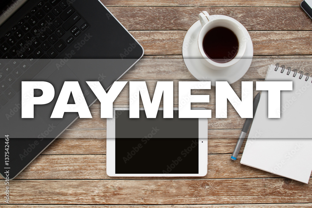 Tablet on desktop with payment text. Tablet on desktop with payment text.