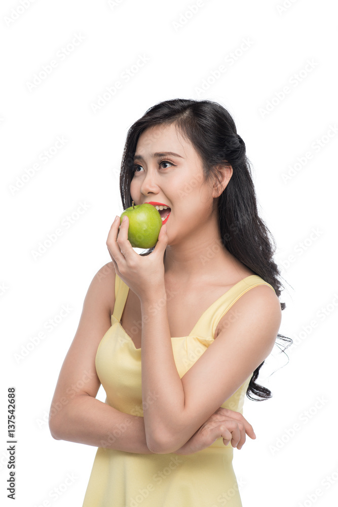 Pretty young asian woman holding fresh apple isolated on white background. Pretty young asian woman holding fresh apple isolated on white background.