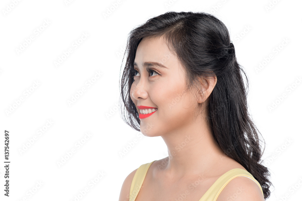 Fototapeta premium Asian young beautiful woman in yellow dress standing over white.