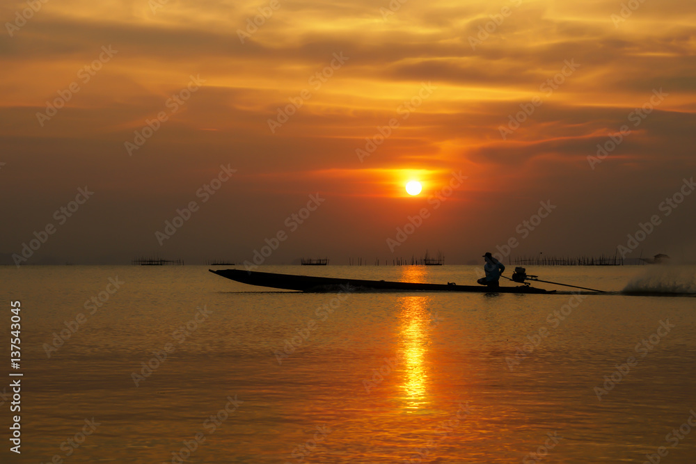 fisherman and sunset sky.