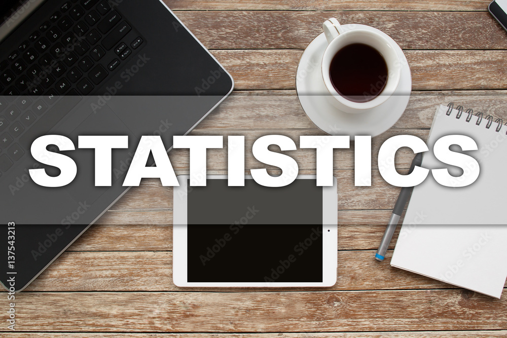 Tablet on desktop with statistics text. Tablet on desktop with statistics text.