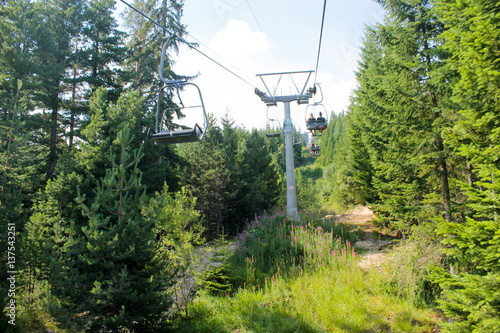 Rila lakes, Bulgaria - August 07 2016 : Ski lift in the summer around a lot of pine trees