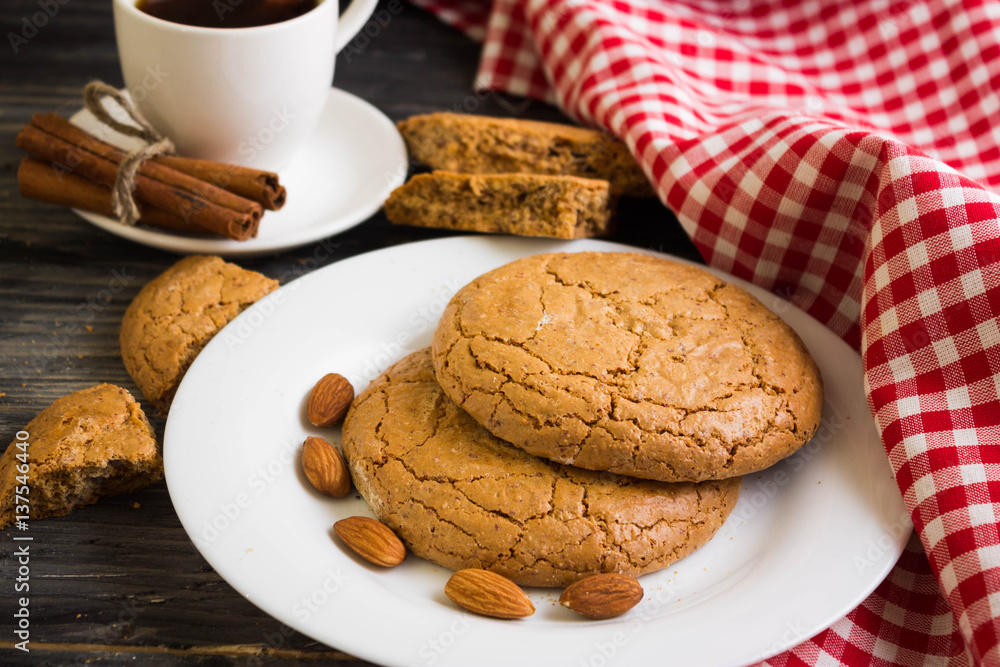 Cookies with almonds on a white plate. Tasty dessert. Cookies with almonds on a white plate. Tasty dessert.