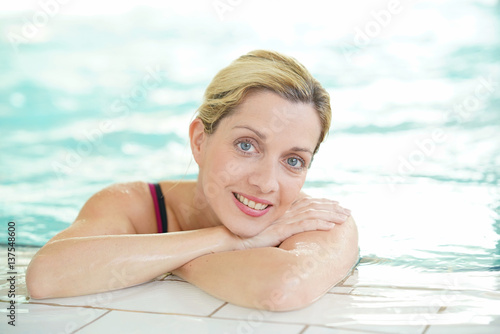 Blond woman relaxing in spa pool