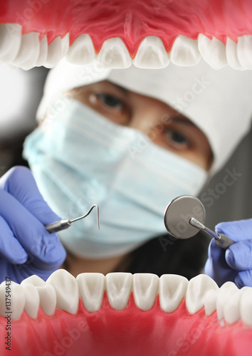 dentist treats teeth, Inside mouth view. Soft focus