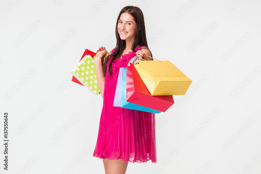 Happy young smiling woman with shopping bags after shopping Happy young smiling woman with shopping bags after shopping