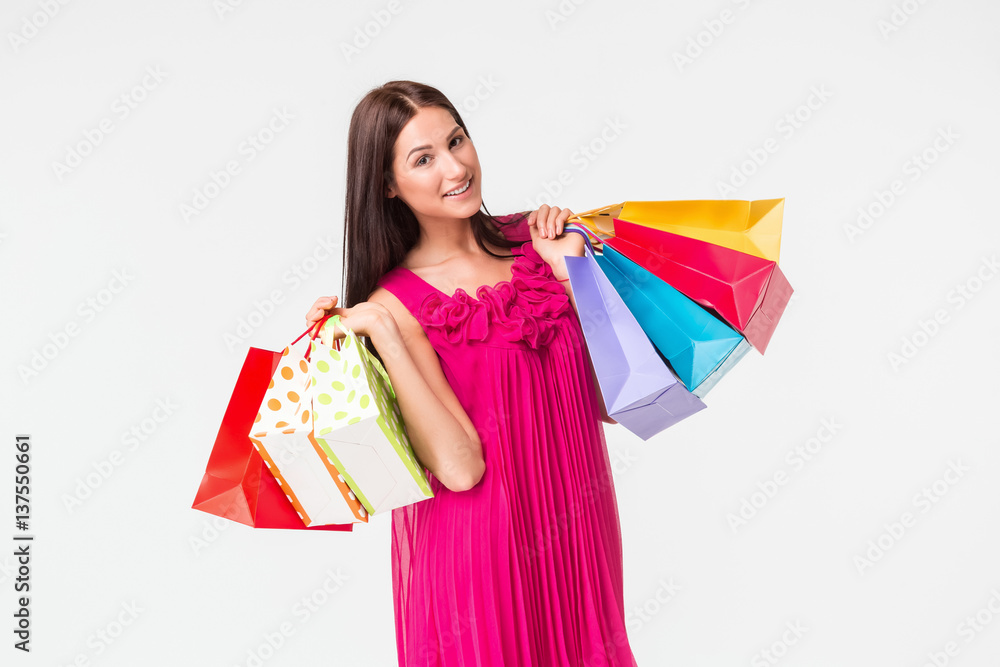 Happy young smiling woman with shopping bags after shopping