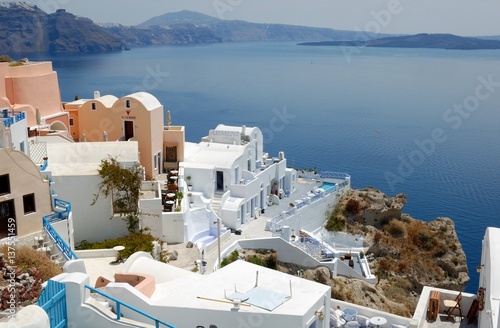 Piece of Mediterranean cruise On Santorini island  Greece. The view from the hotel on the lower terrace and the shore of the Aegean sea. characteristic architecture blue and white tones in the decor