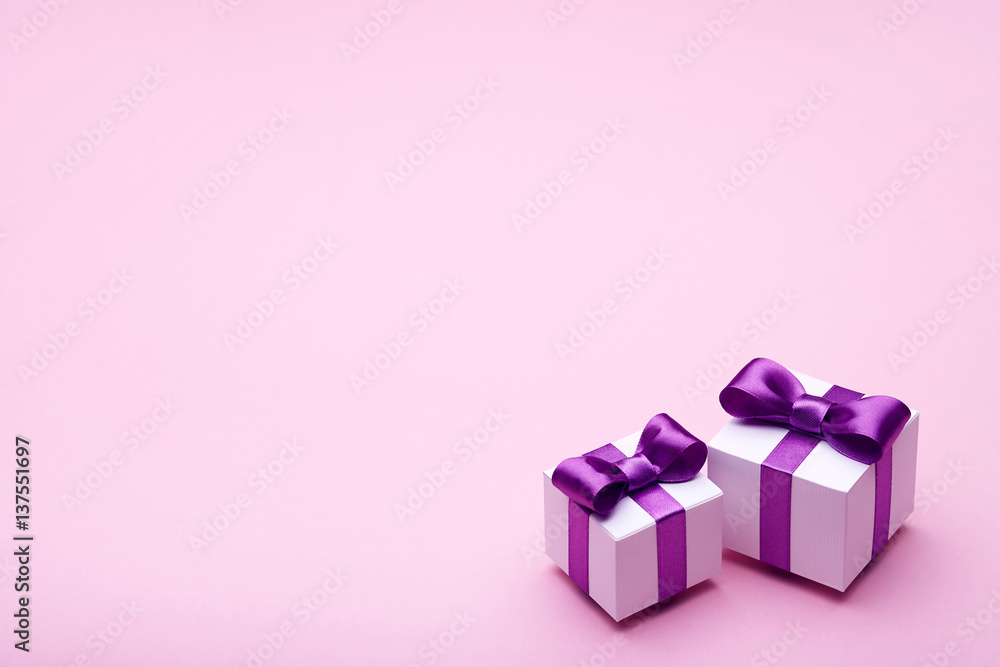 Gifts with satin bows on pink Gifts with satin bows on pink