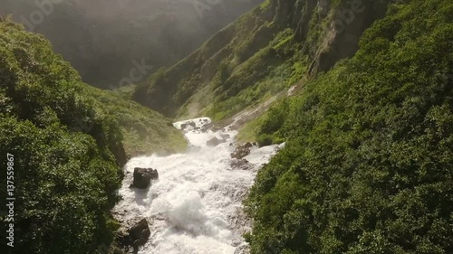 Camera flies away from the waterfall to the bottom