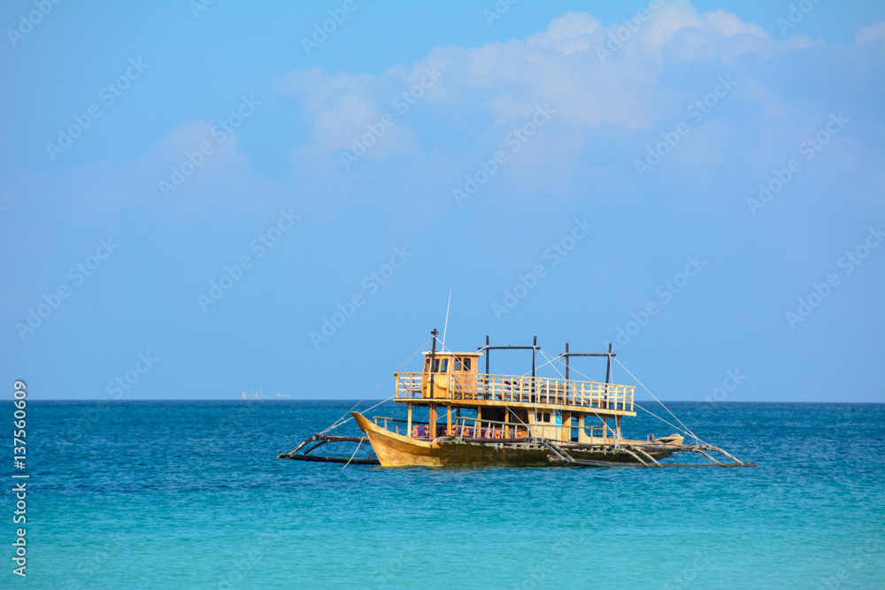 Boat in the Blue Lagoon Boracay Island, Philippines