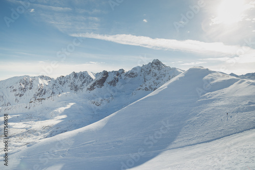 Snowy slopes in winter mountains. Skiing resorts. © vladdeep