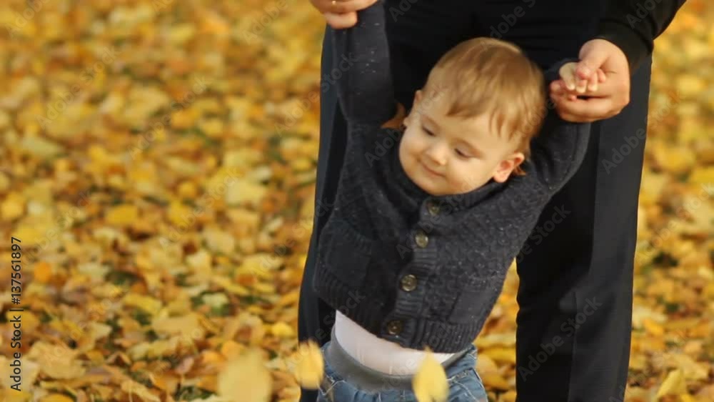 Family having fun and throwing yellow leaves at park Family having fun and throwing yellow leaves at park