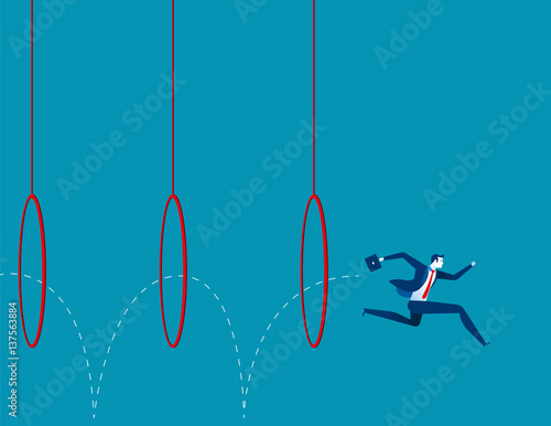 Business man jumping through hoops