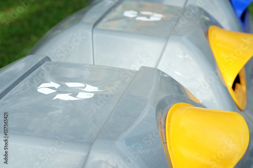recycle bins in public park,focus on recycle symbol