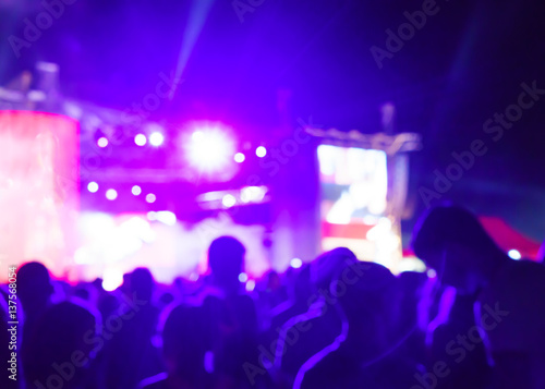 Blurred Youth Music Festival of pop music. Laser show on the stage. The crowd of fans. Bright abstract background ideal for any design. Blurred bokeh basic background for design 