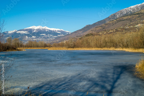 mountain panorama  with frozen lake  trees and forest