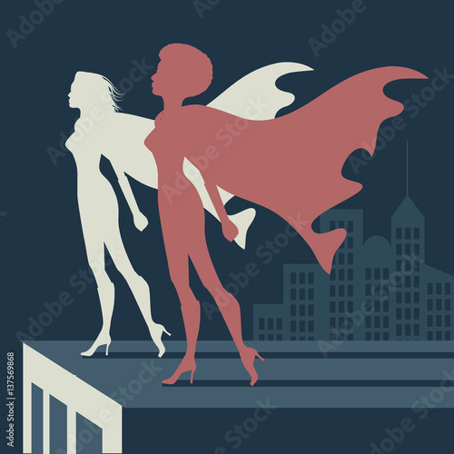Female Super heroes atop a skyscraper background. Standing strong  in a cityscape. With dimensional type and space for your copy. EPS 10 vector.