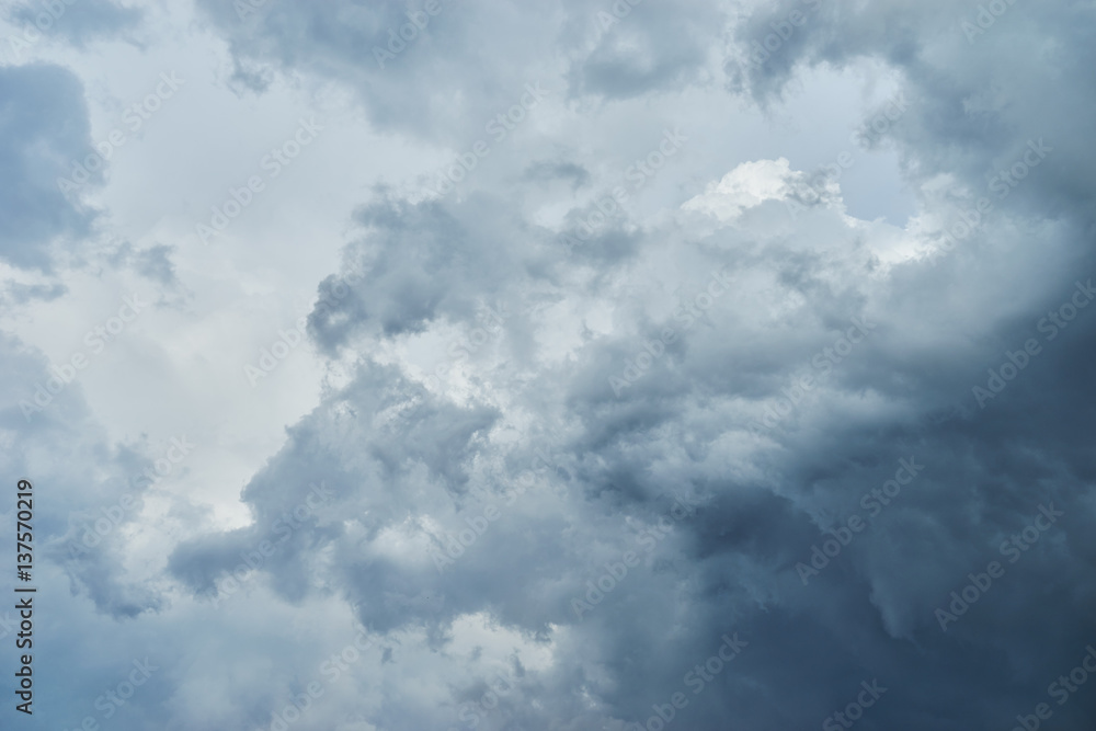 Crazy dark clouds are gathering displacing blue sky. Bright heaven background. Basic background for design Crazy dark clouds are gathering displacing blue sky. Bright heaven background. Basic background for design