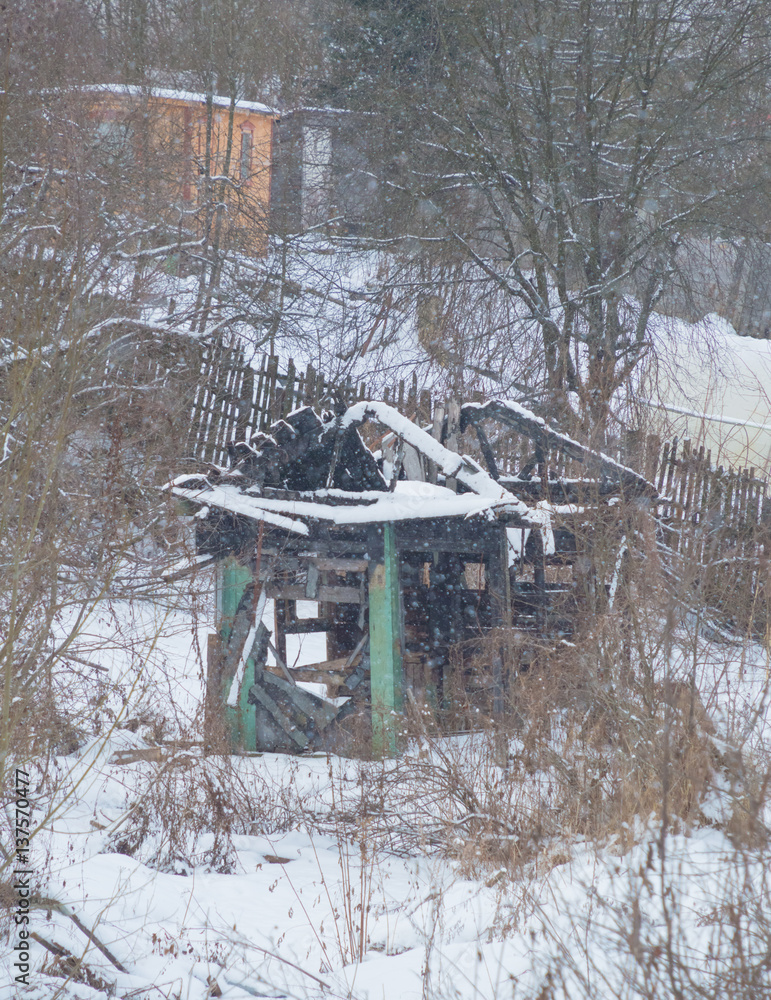 the house burned in the winter in the village. the house burned in the winter in the village.