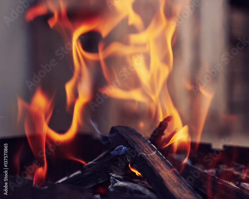 Bright flames. BBQ grill. Hot coal. Burned wood 