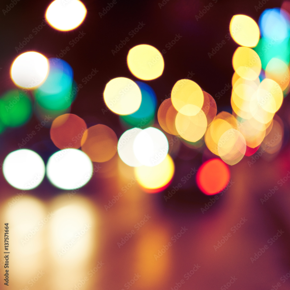 Obraz premium Blurred background with lights of the city at night. Bokeh basic background for design