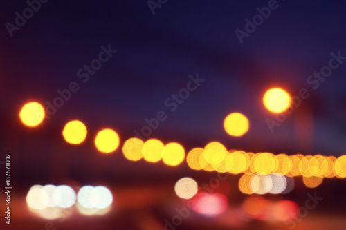 Blurred background with lights of the city at night. Big city bridge. Bokeh basic background for design © marina_larina