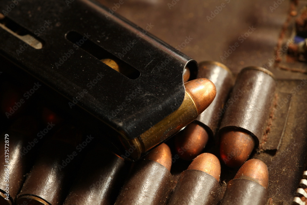 The full load of pistol magazine in the scene appear the bullet pocket background represent the weapon and bullet concept related idea. The full load of pistol magazine in the scene appear the bullet pocket background represent the weapon and bullet concept related idea.