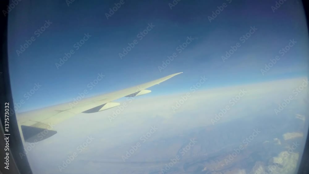 Timelapse 4K Hd Ultra Traveling by air. Wonderful view of the sky and clouds from above, as seen through an airplane window-Dan Timelapse 4K Hd Ultra Traveling by air. Wonderful view of the sky and clouds from above, as seen through an airplane window-Dan