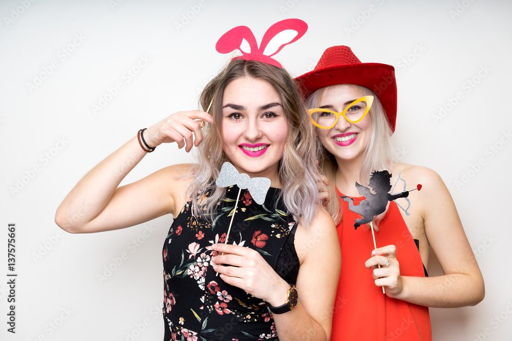 happy ladies girls female with fancy dress photo booth props smile