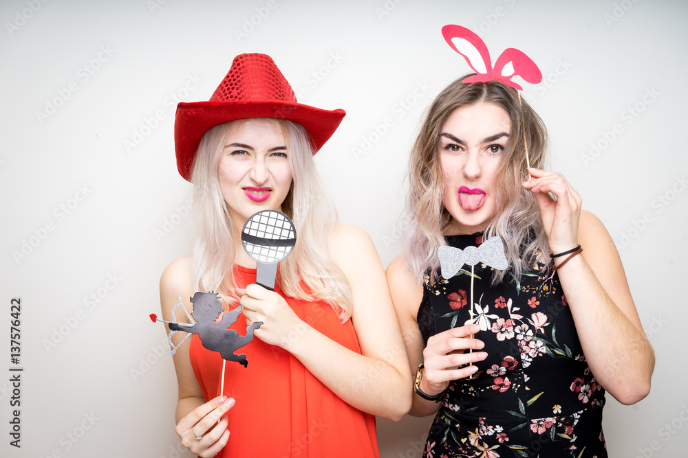 happy ladies girls female with fancy dress photo booth props smile party white isolated background