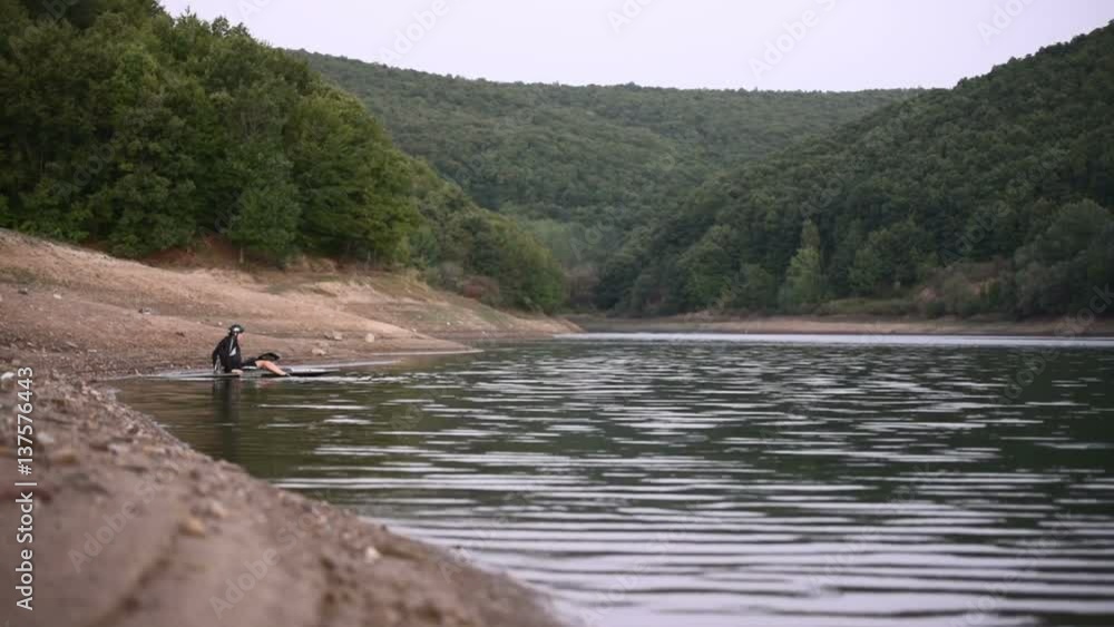 Female kayaker prepairing for a rowing practice Female kayaker prepairing for a rowing practice