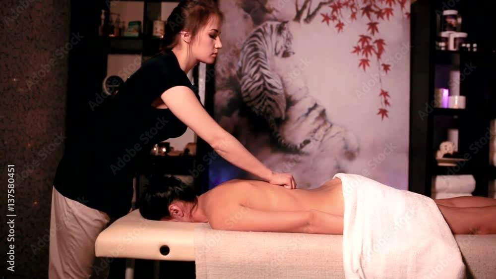 Brunette Client Receiving Body Massage at Spa Club Brunette Client Receiving Body Massage at Spa Club
