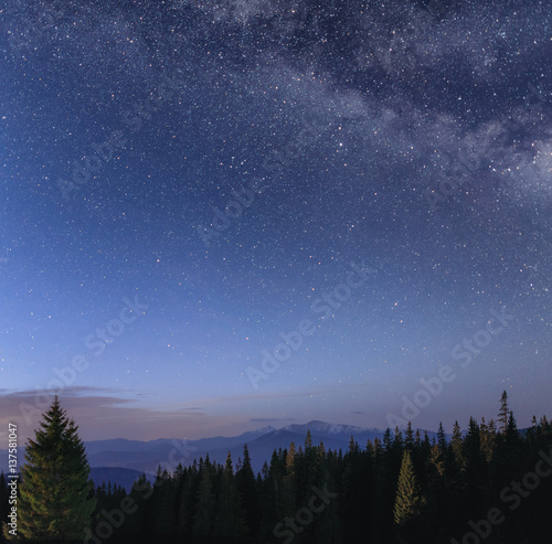 Night sky with Milky Way over the mountain landscape