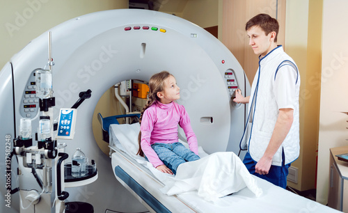 Medical equipment. Doctor and patient in the room of computed tomography